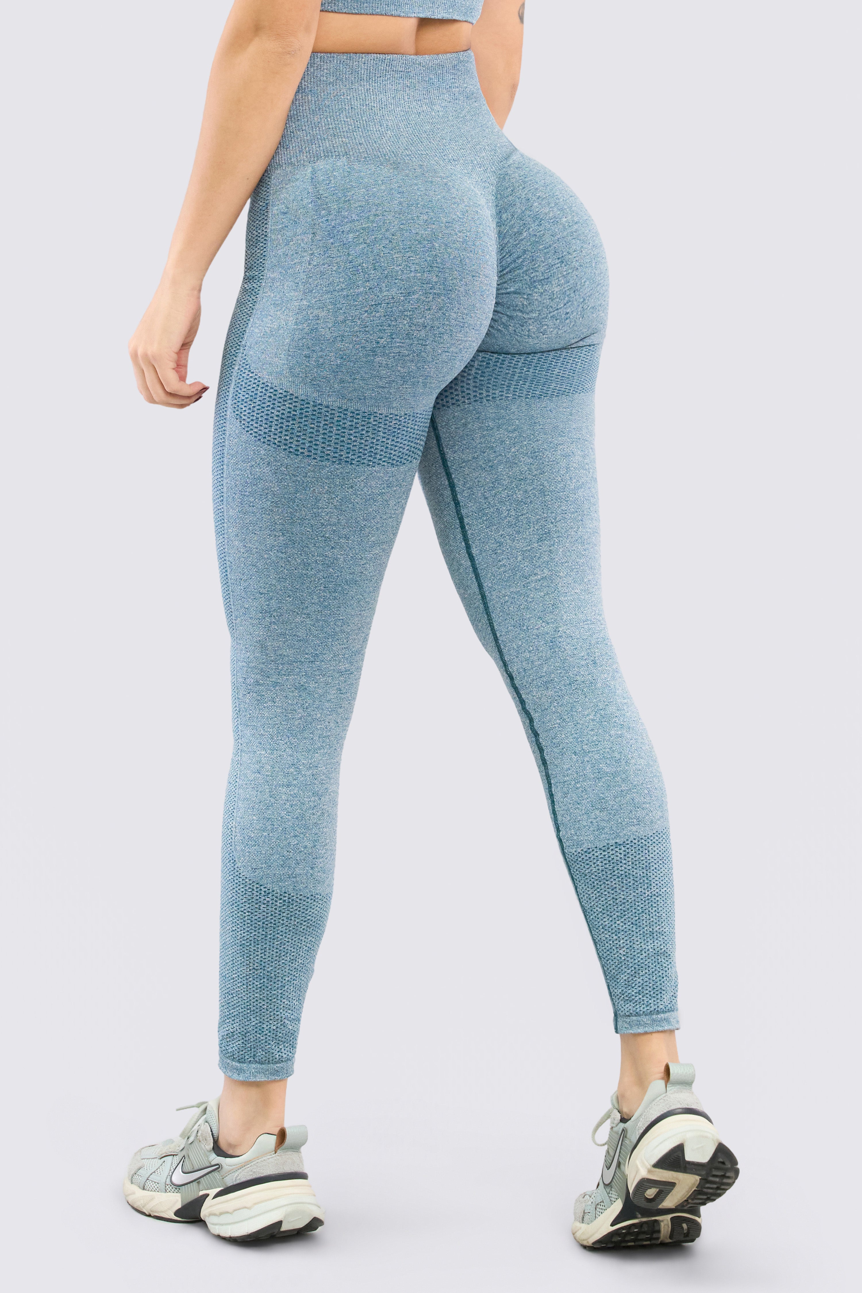 Seamless blue leggings with gathered detailing on the buttocks.