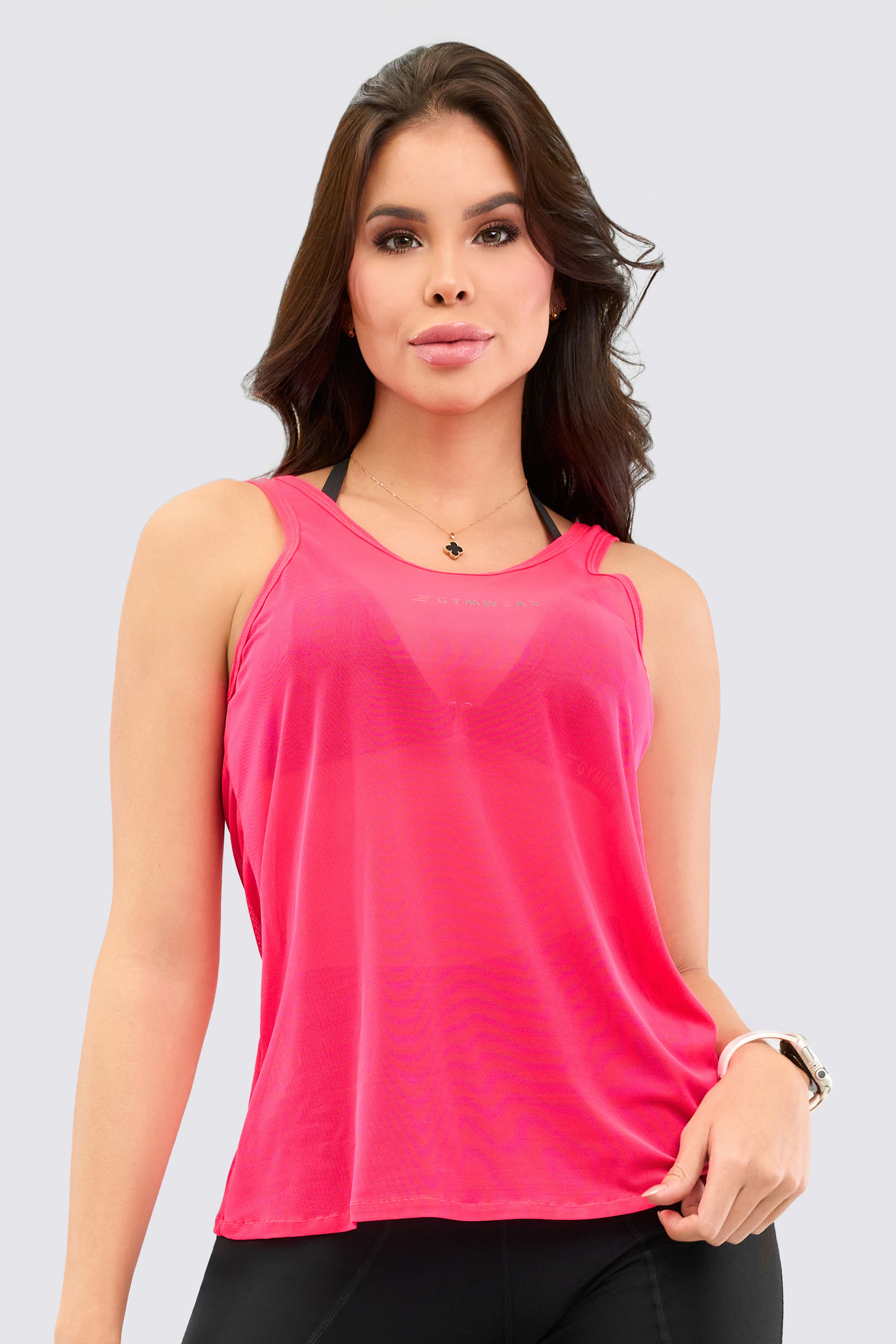Fuchsia sports mesh top with crisscross straps at the back, sleeveless, and loose fit.