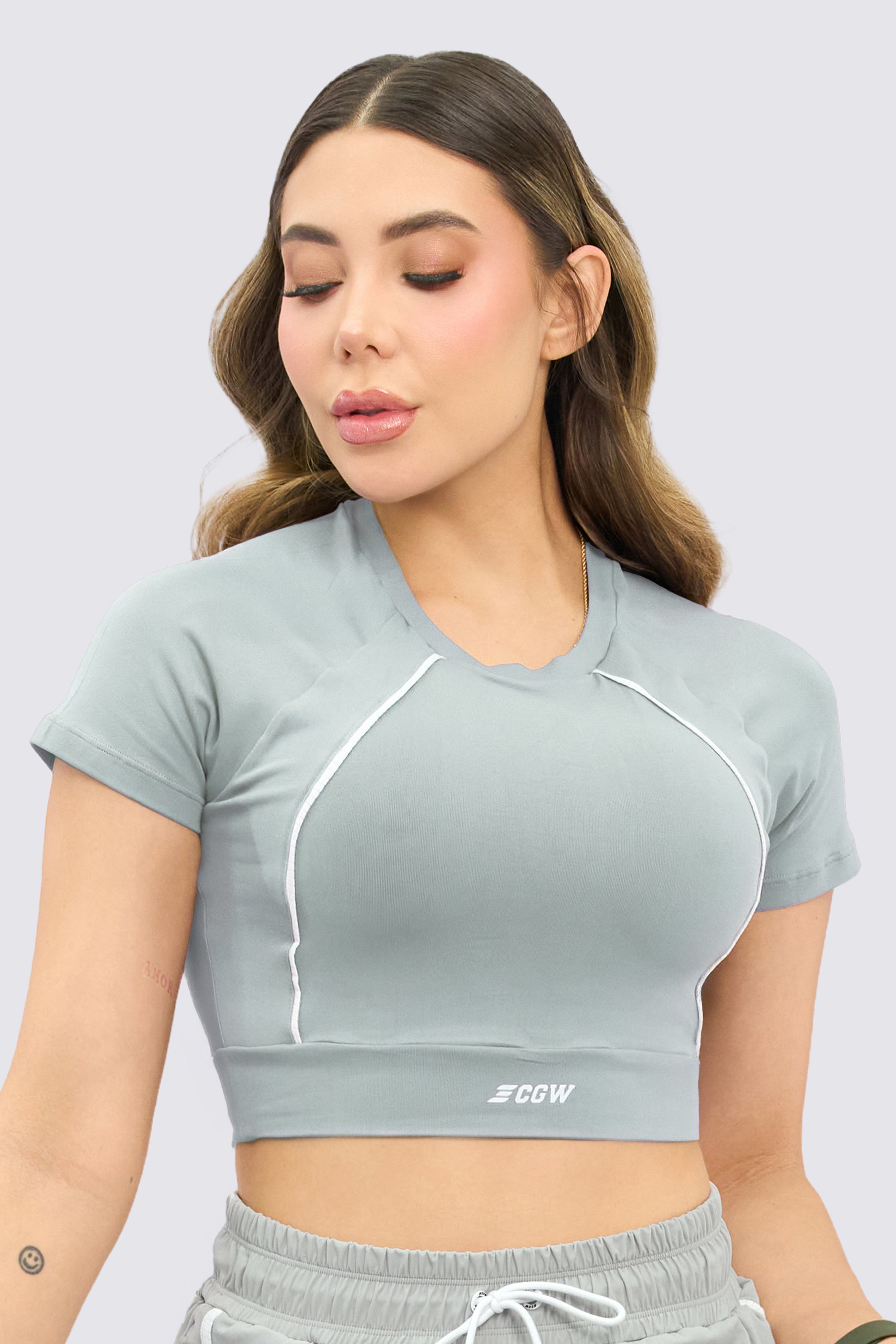 Grey athletic crop top with a snug fit.