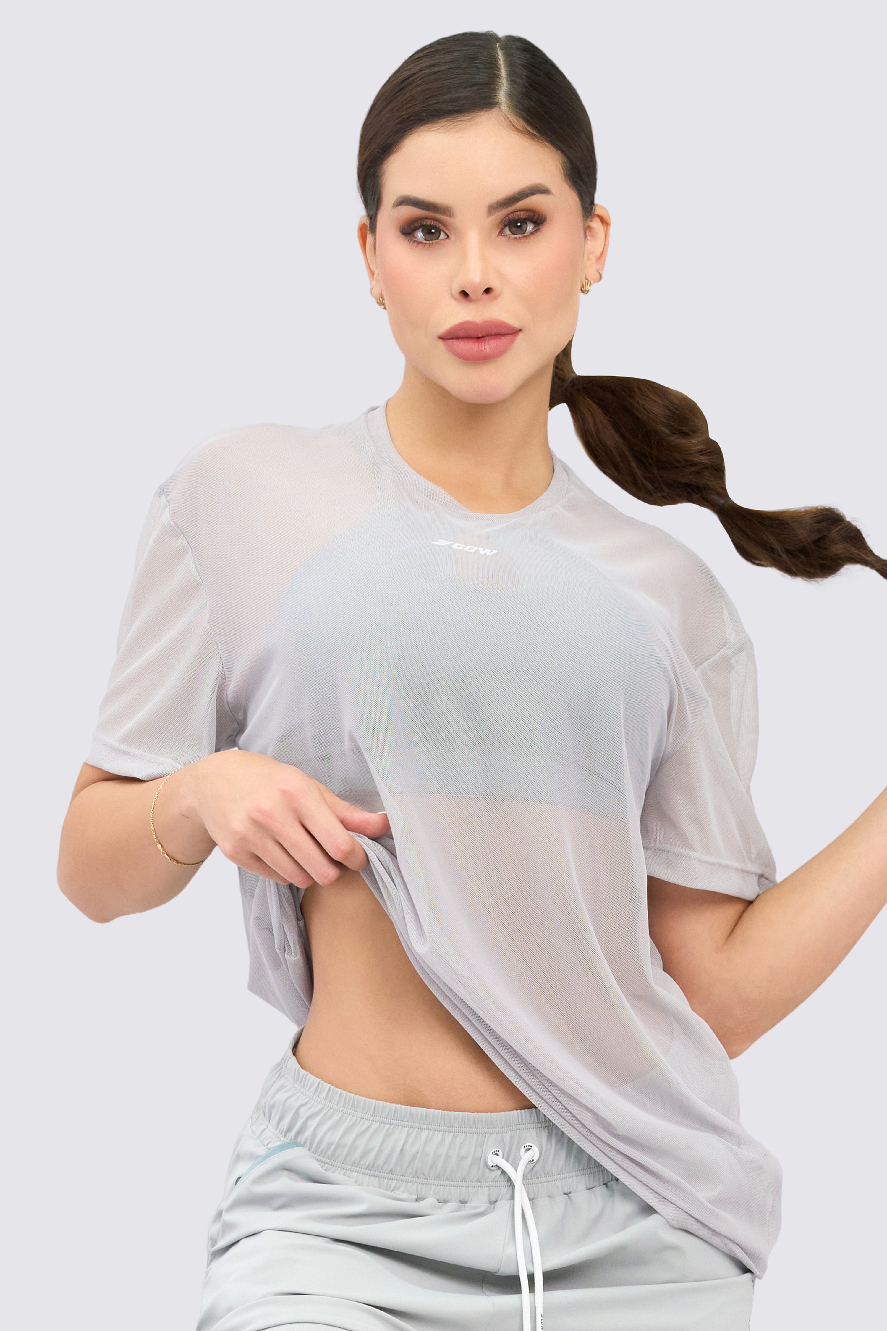 Breathable gray mesh blouse, loose fit and perfect for mixing and matching.