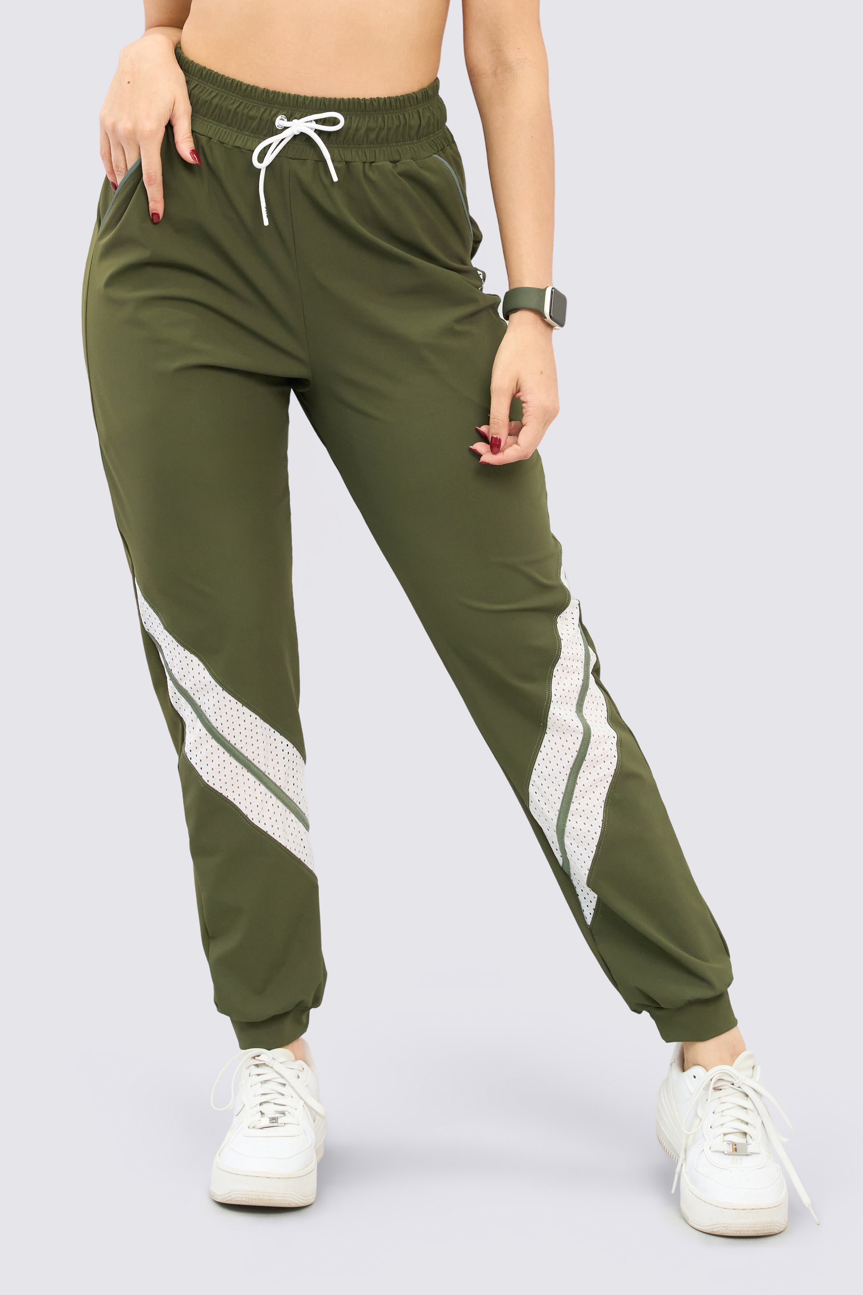 Green athletic joggers with breathable mesh, side pockets, and adjustable waistband.
