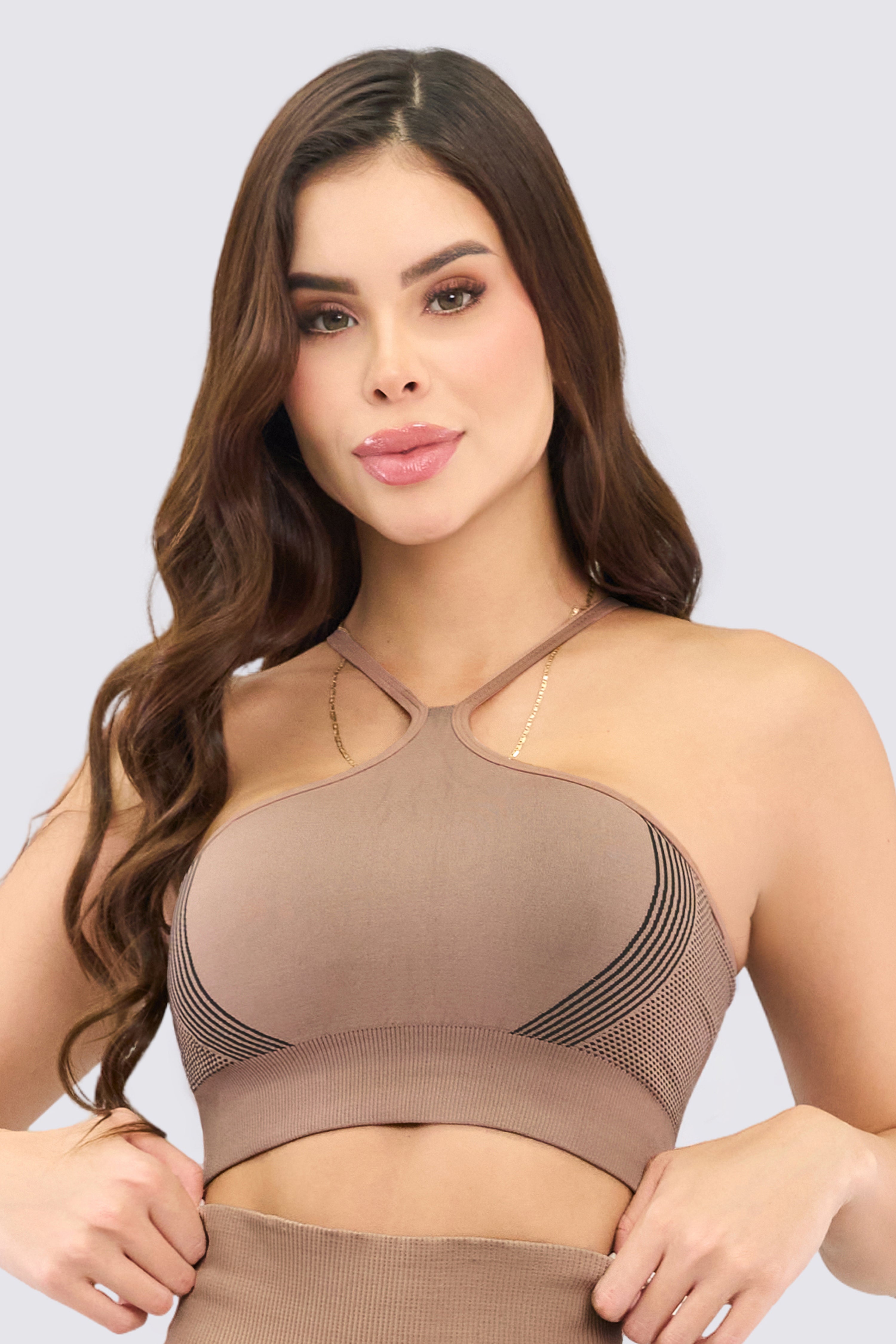 Seamless sports top in nude color with medium support.