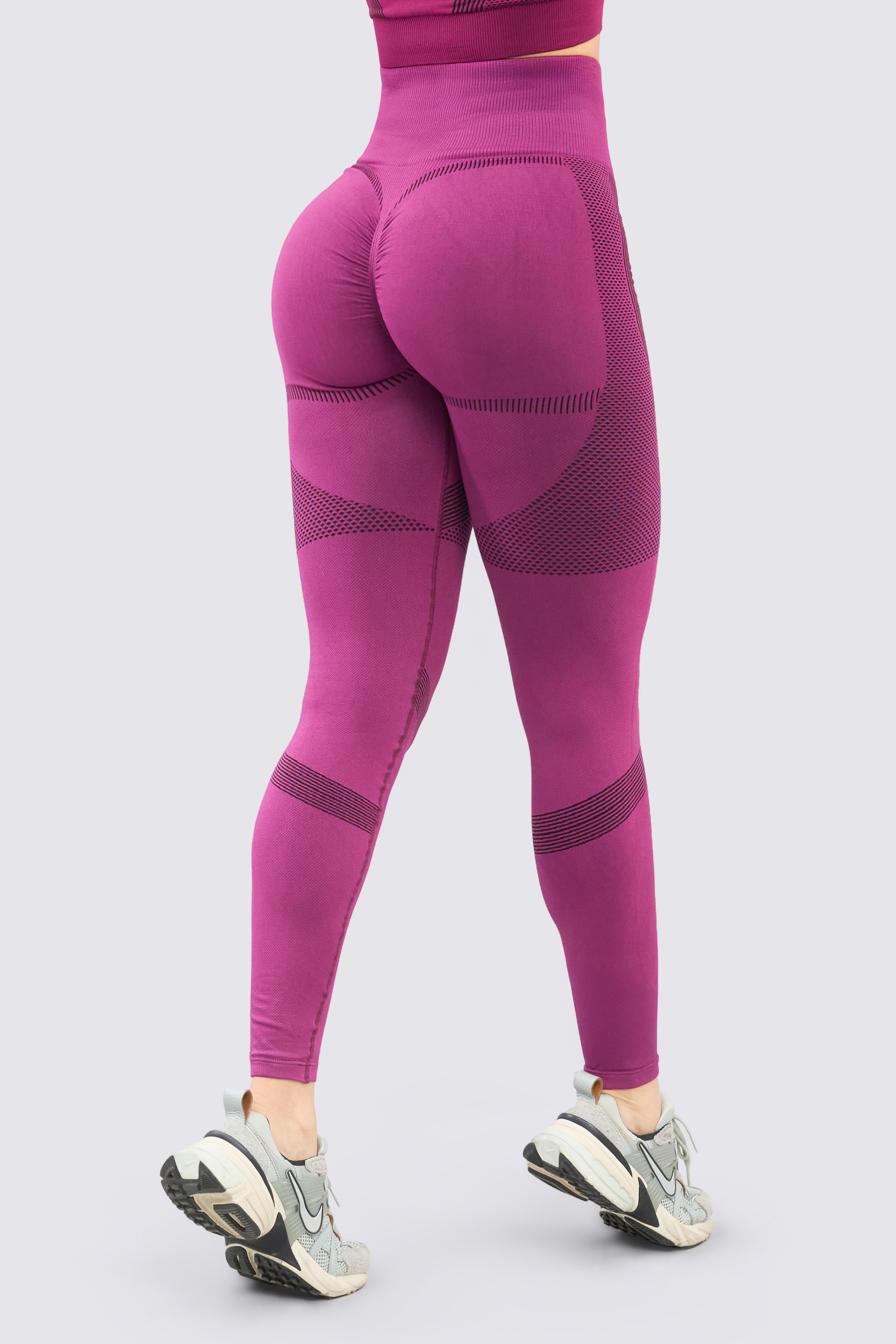 Purple sports leggings with scrunch at the buttocks.