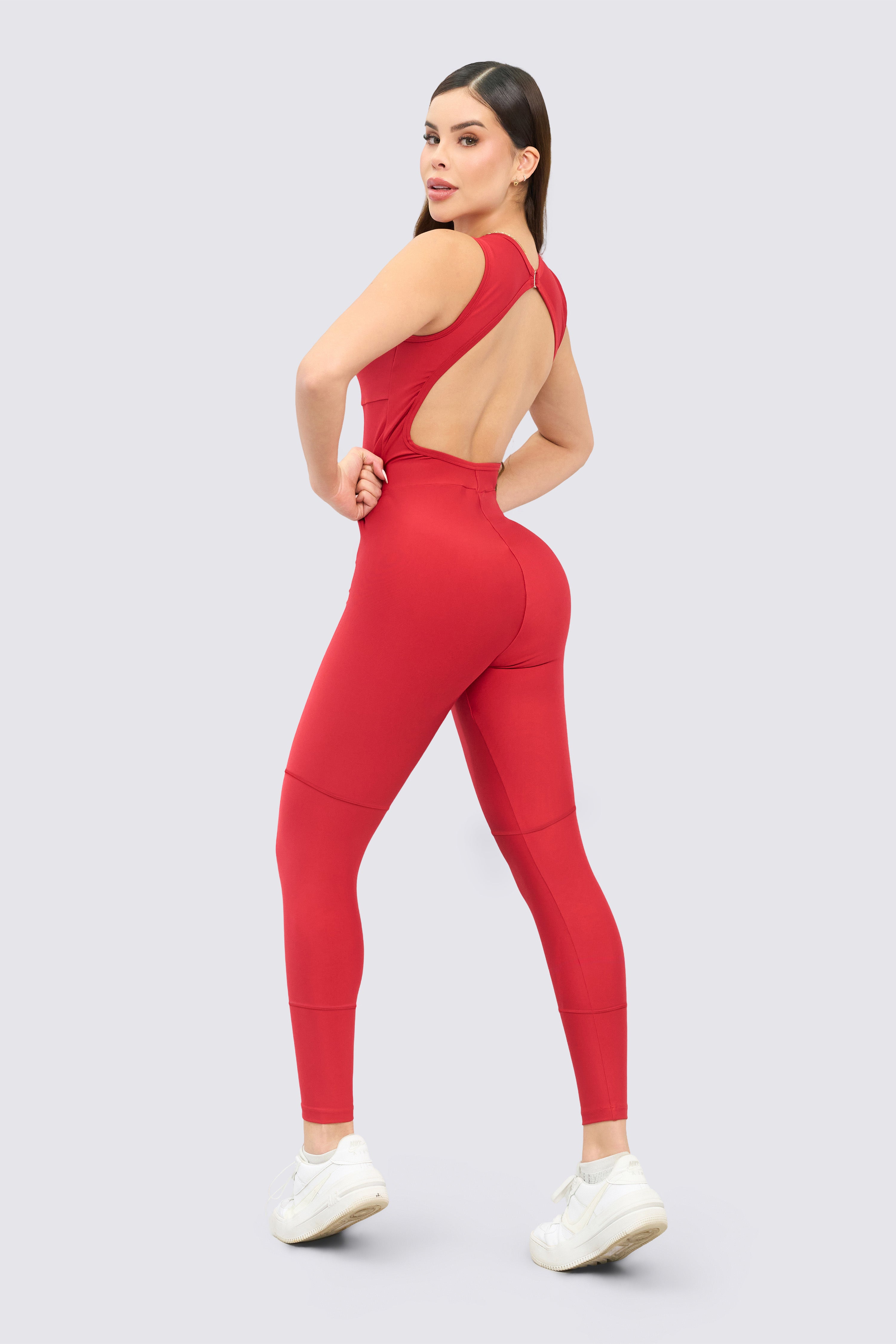 Red jumpsuit with a low-cut back and daring design.