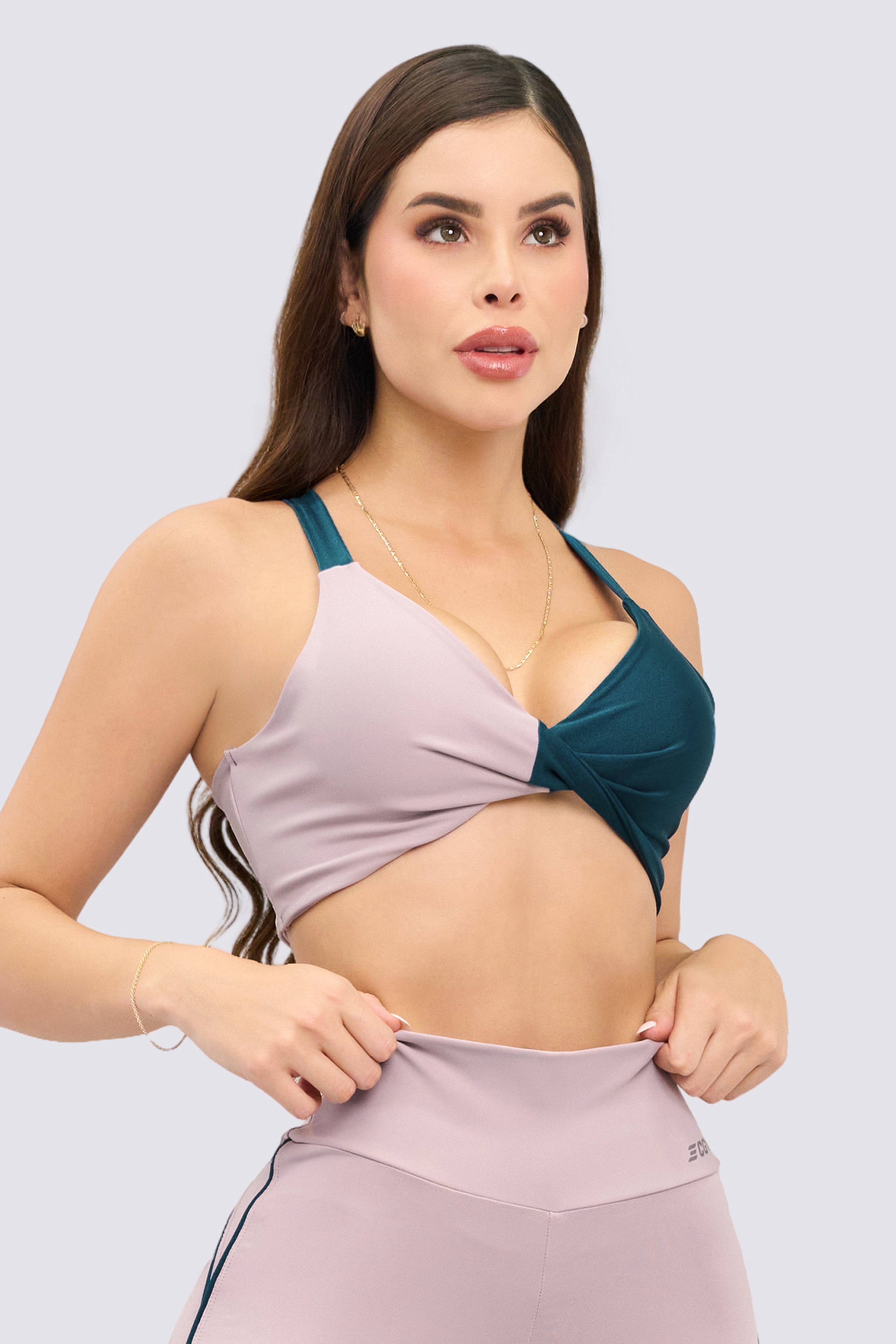 Sports bra-style top in rosewood color with a unique medium support design.