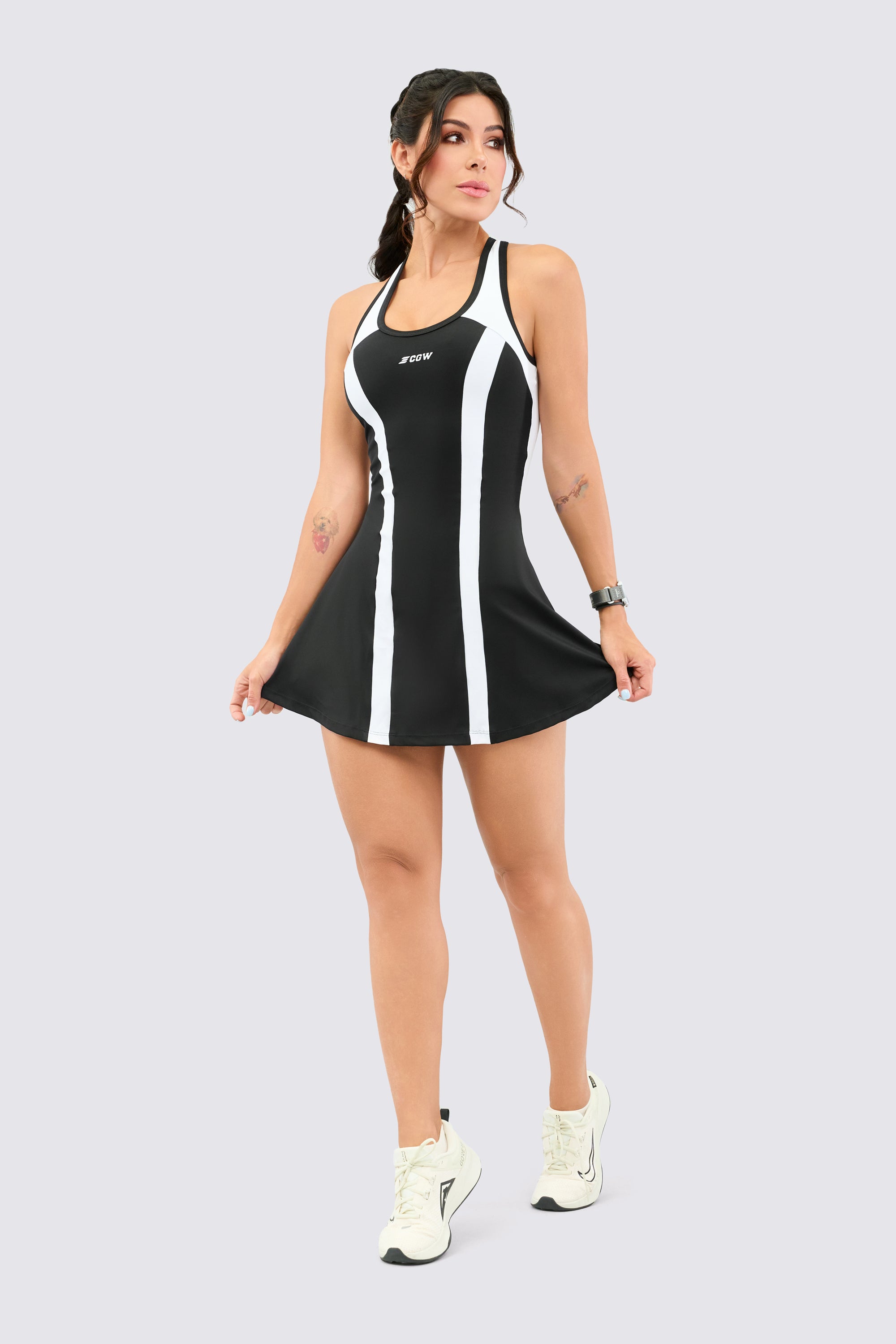 Sports dress with inner shorts, with black panels and back neckline.
