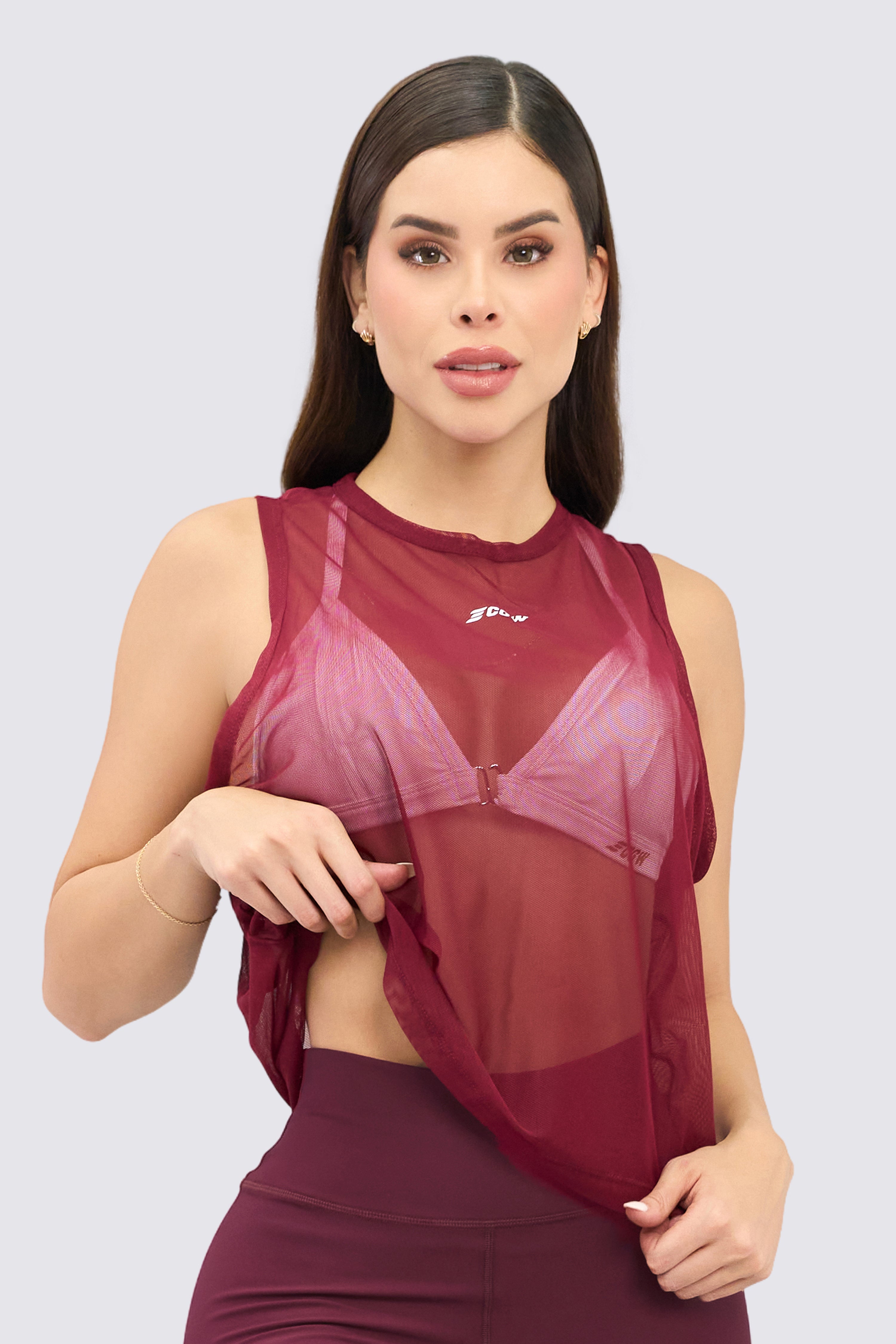 Lightweight wine mesh sports top with a relaxed fit. Ideal for layering and keeping cool during workouts.