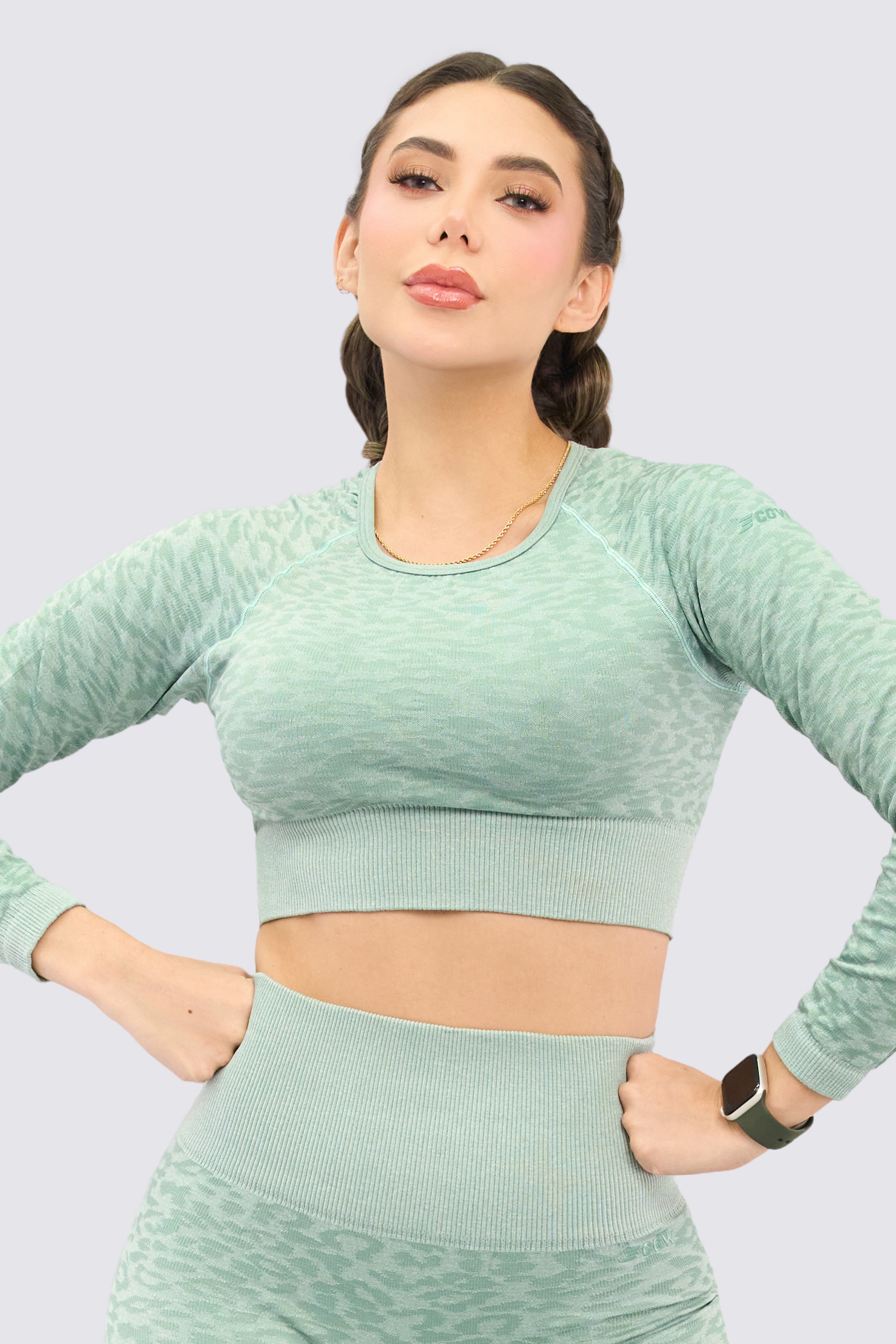 Green sports jumpsuit with animal print pattern.