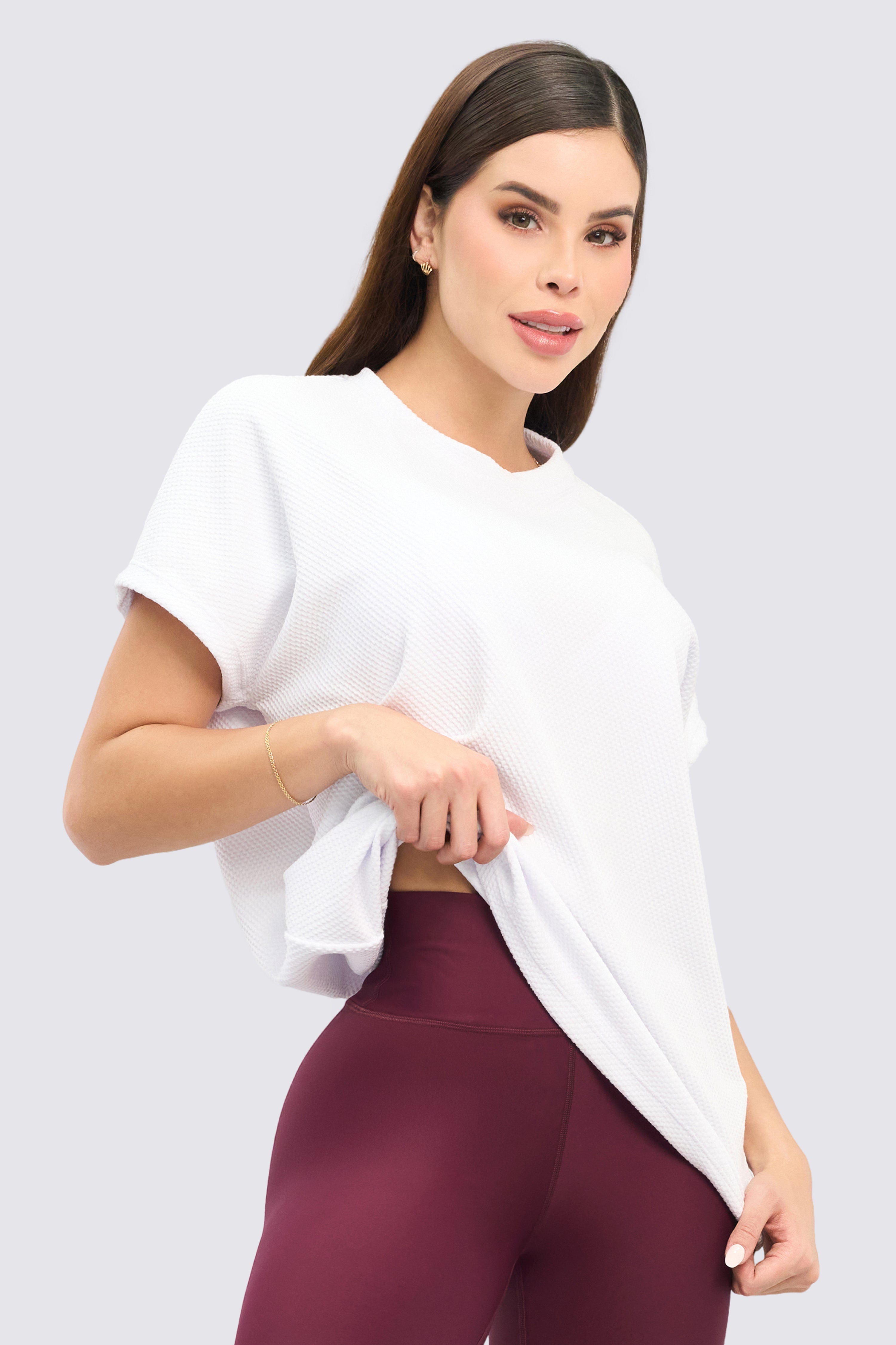White oversized sports blouse made of coarse fabric. 
