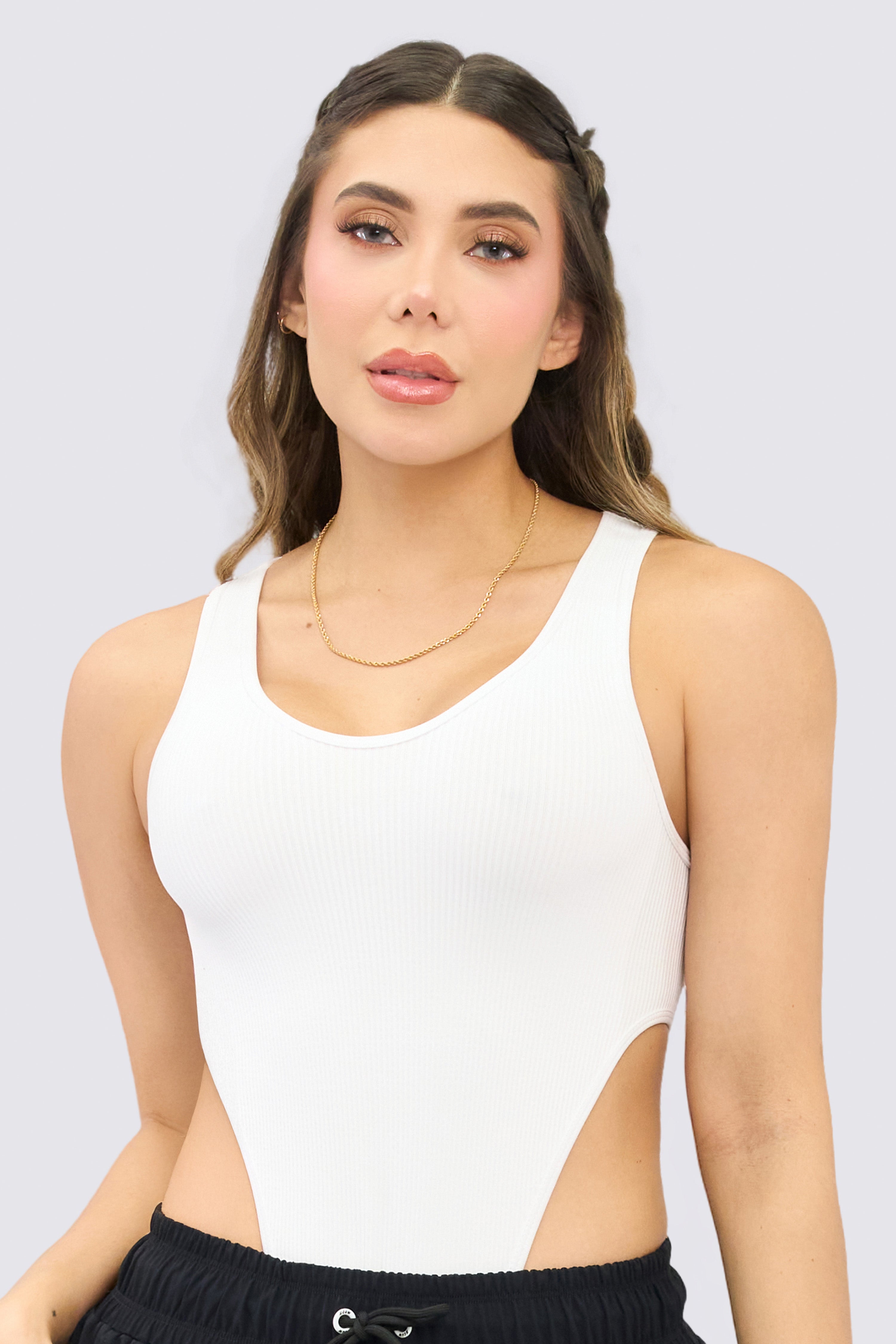 White, stretchy, sleeveless bodysuit.